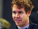 A relaxed Sebastian Vettel in the Red Bull garage