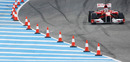 Fernando Alonso heads past the cones
