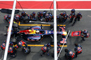 Sebastian Vettel makes a pit stop in the Red Bull