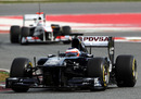 Rubens Barrichello leads Kamui Kobayashi on track