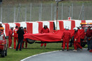 Felipe Massa's Ferrari is retrieved from the gravel