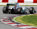 Nico Rosberg holds a tight line out of the corner