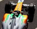 Adrian Sutil noses out of the Force India garage