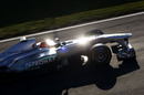 The morning sun bounces off Michael Schumacher's Mercedes W02