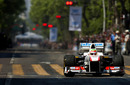Sergio Perez drives his Sauber during a demonstration on the streets of  Guadalajara