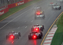 Cars battle for position in the wet
