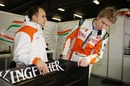 Nico Hülkenberg surveys the rear wing of his Force India