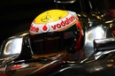 Lewis Hamilton contemplates his day ahead in the McLaren