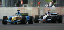 Kimi Raikkonen lines up Giancarlo Fisichella on the last lap
