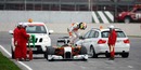 Paul Di Resta jumps out of his stricken Force India