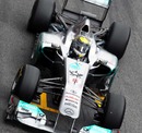 Nico Rosberg guides his Mercedes down the pit lane