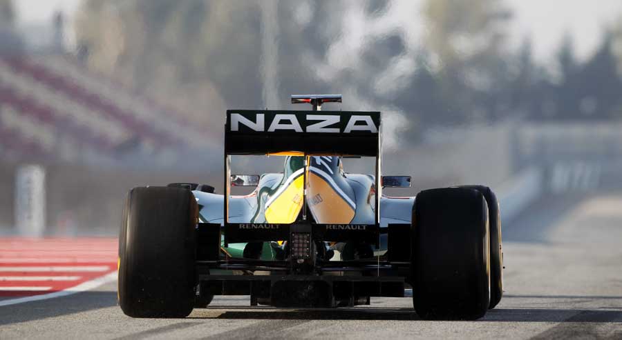 Jarno Trulli takes to the track in the Lotus T128