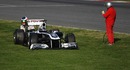 Rubens Barrichello inspects the back of his stricken Williams
