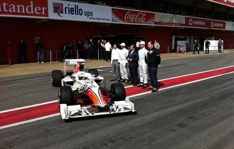 HRT launches its new F111 in the pitlane on Friday lunchtime