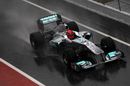Michael Schumacher braves a lap in the rainy conditions