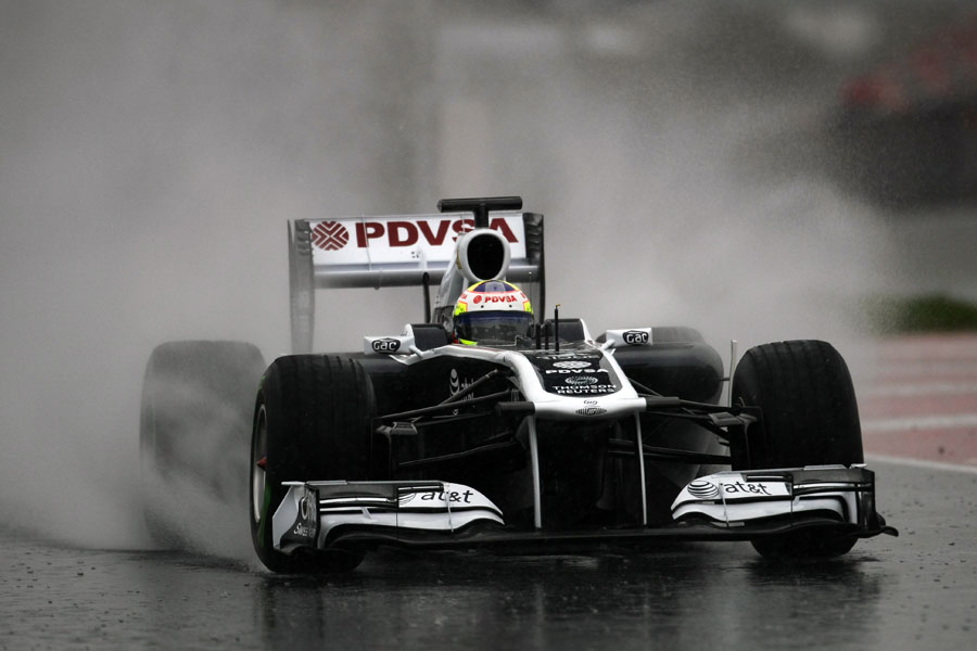 Pastor Maldonado leaves the pits in a cloud of spray