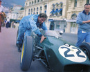 An exhausted Innes Ireland trying to push his Lotus 18 up the hill at Monaco