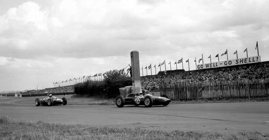 Trevor Taylor in a Lotus followed by Phil Hill in a Ferrari