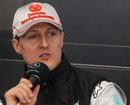 Michael Schumacher talks to the press in Mercedes' hospitality unit