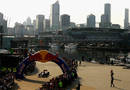 Mark Webber drives his Red Bull along Docklands Waterfront as part of the build-up to the Australian Grand Prix