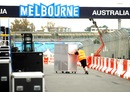 Freight is moved towards the garages as preparations continue for the Australian Grand Prix