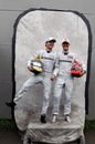 Nico Rosberg and Michael Schumacher share a joke with photographers 