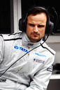 Tonio Liuzzi watches on from the pit wall after his HRT failed to make the track in first practice