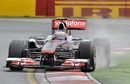 Jenson Button runs slightly wide on his way to the fastest time of the second session