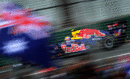 Mark Webber speeds past an Australian flag in final practice