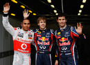 Sebastian Vettel poses with Lewis Hamilton and Mark Webber after securing pole