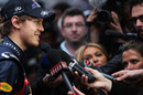 Sebastian Vettel faces the media after taking pole position
