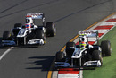 Rubens Barrichello battles team-mate Pastor Maldonado