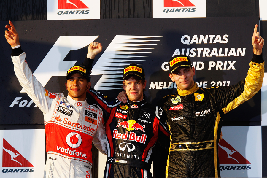 Lewis Hamilton, winner Sebastian Vettel and and third-placed Vitaly Petrov take the plaudits