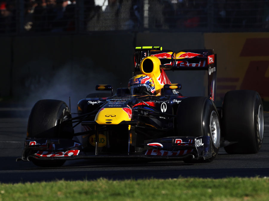 Mark Webber locks a tyre during his first stint