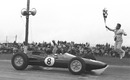Jim Clark takes the chequered flag