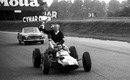 Jim Clark gives Colin Chapman a lift round the circuit with the winner's trophy