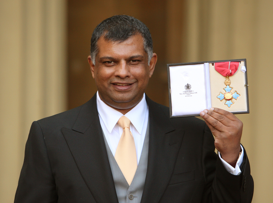 Lotus boss Tony Fernandes holds his CBE medal awarded to him by Princess Anne at an investiture ceremony at Buckingham Palace