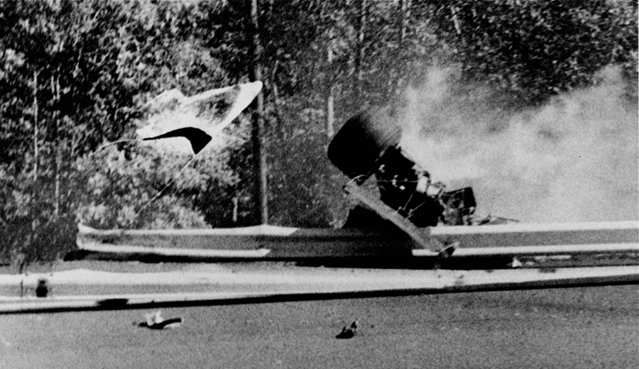Francois Cevert's Tyrrell sits on the guardrail after his fatal crash
