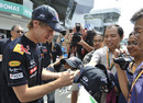Sebastian Vettel signs autographs for his Malaysian fans