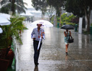Rain lashes the paddock at Sepang