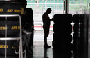 A lone Ferrari mechanic checks tyres at Sepang