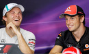 Jenson Button and Nico Rosberg share a joke during the press conference