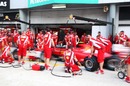 Ferrari mechanics run through another pit stop