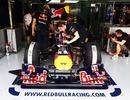 Mark Webber's pit crew work on his car