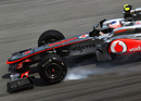 Jenson Button locks up under braking