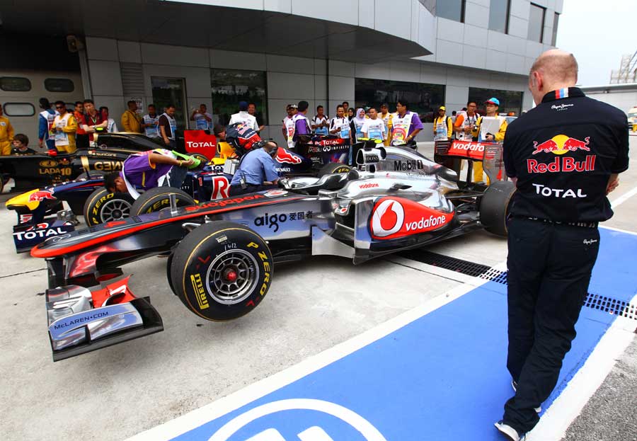 Adrian Newey casts his eye over McLaren's MP4-26 outside scrutineering