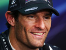 Mark Webber talks to the media in a press conference