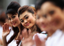 Petronas grid girls smile for the camera