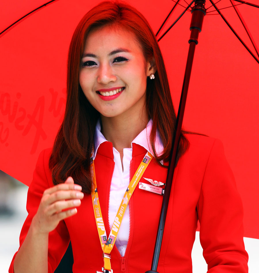 An Air Asia stewardess outside the Lotus garage