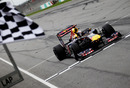 Sebastian Vettel crosses the line to take victory for Red Bull